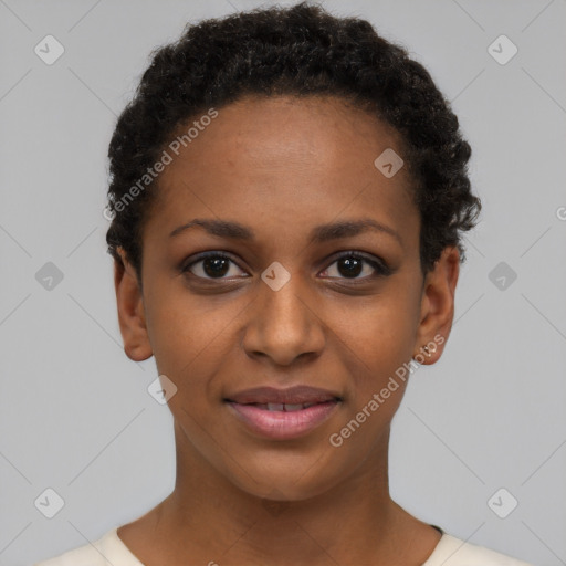 Joyful black young-adult female with short  black hair and brown eyes