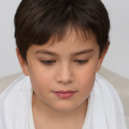 Joyful white child female with short  brown hair and brown eyes