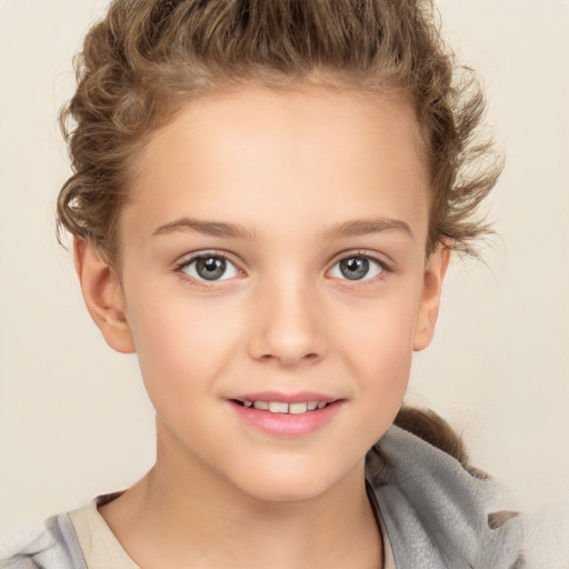 Joyful white child female with short  brown hair and brown eyes