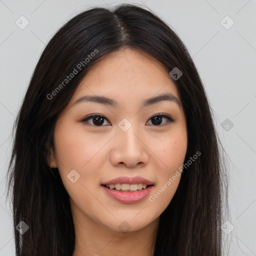 Joyful asian young-adult female with long  brown hair and brown eyes