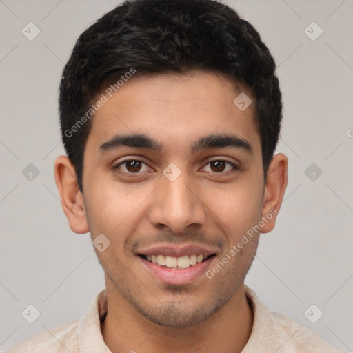 Joyful white young-adult male with short  black hair and brown eyes