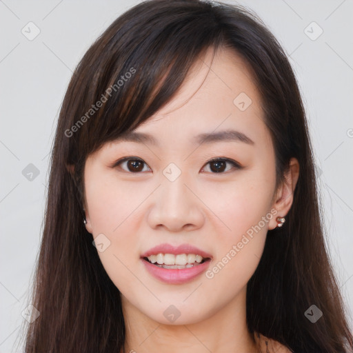 Joyful asian young-adult female with long  brown hair and brown eyes