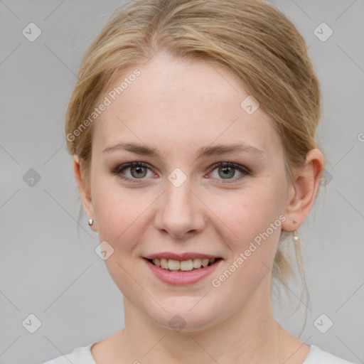 Joyful white young-adult female with medium  brown hair and blue eyes