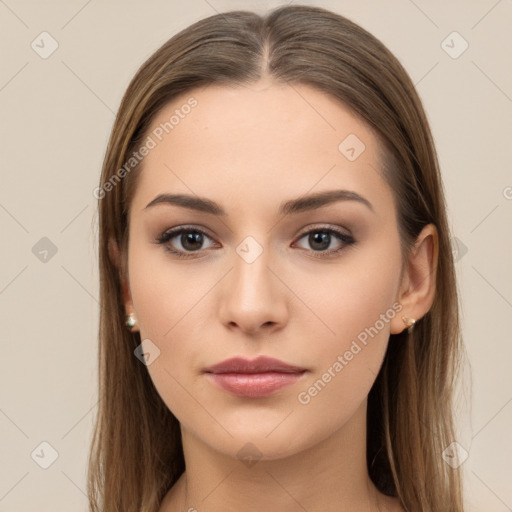 Neutral white young-adult female with long  brown hair and brown eyes