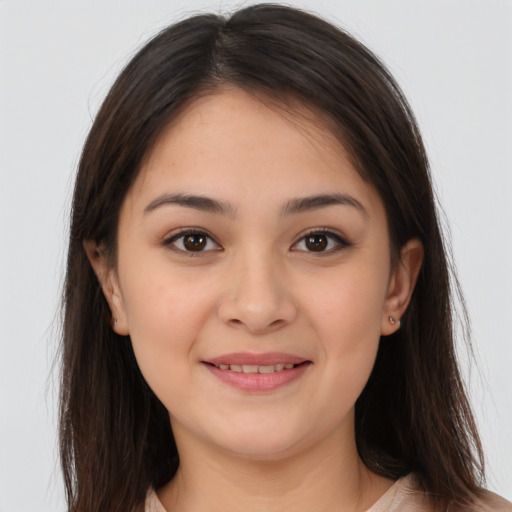 Joyful white young-adult female with long  brown hair and brown eyes