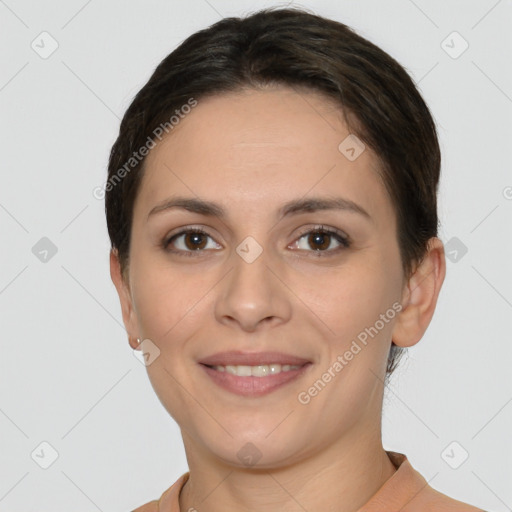 Joyful white young-adult female with short  brown hair and brown eyes