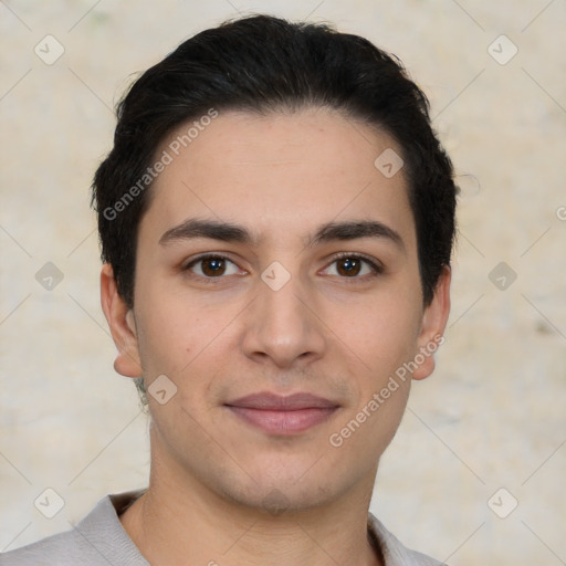 Joyful white young-adult male with short  black hair and brown eyes