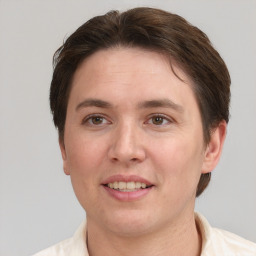 Joyful white adult female with short  brown hair and grey eyes