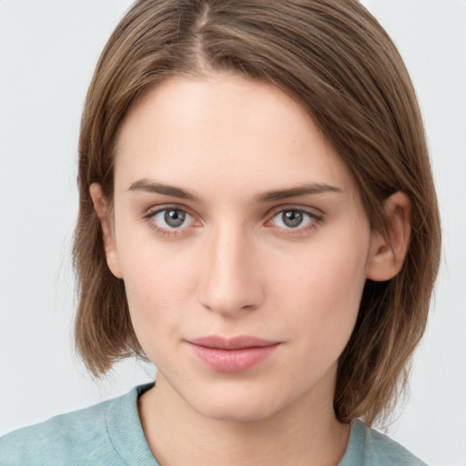 Neutral white young-adult female with medium  brown hair and grey eyes