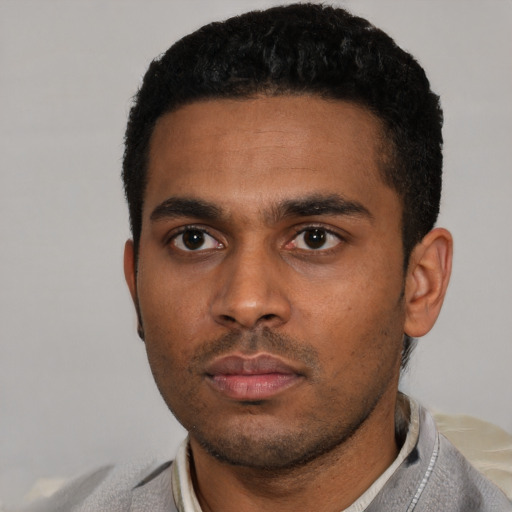 Neutral latino young-adult male with short  black hair and brown eyes