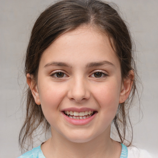 Joyful white child female with medium  brown hair and brown eyes