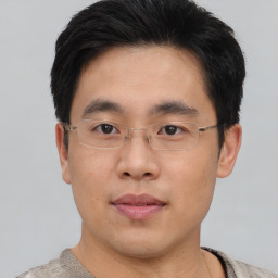 Neutral asian young-adult male with short  brown hair and brown eyes