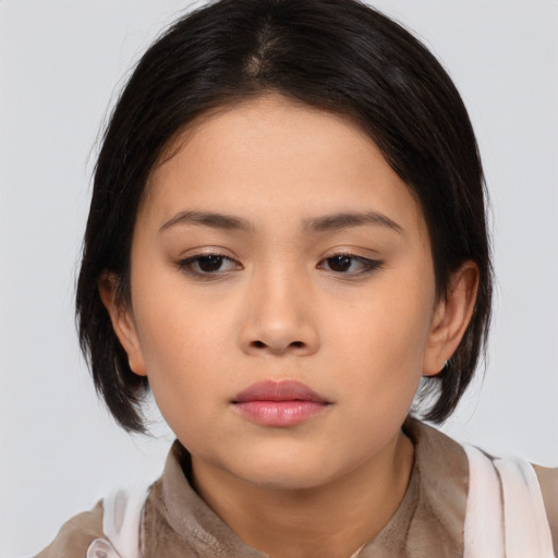 Neutral asian young-adult female with medium  black hair and brown eyes