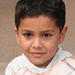 Joyful white child male with short  brown hair and brown eyes