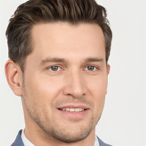 Joyful white young-adult male with short  brown hair and brown eyes