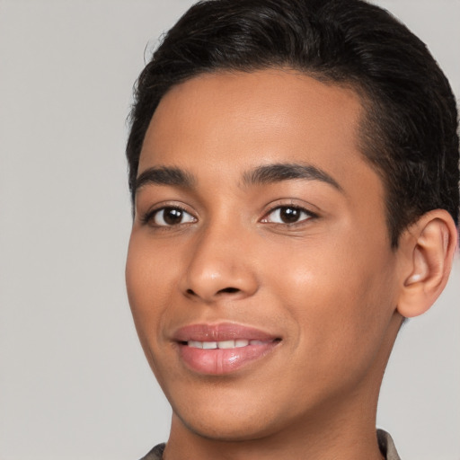 Joyful latino young-adult male with short  brown hair and brown eyes