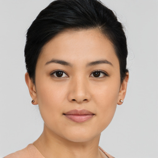 Joyful asian young-adult female with short  black hair and brown eyes