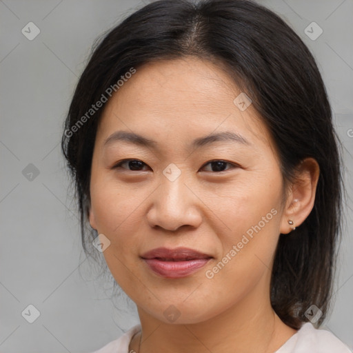 Joyful asian young-adult female with medium  brown hair and brown eyes