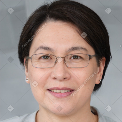 Joyful white adult female with medium  brown hair and brown eyes