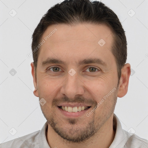 Joyful white adult male with short  brown hair and brown eyes