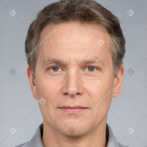 Joyful white adult male with short  brown hair and grey eyes