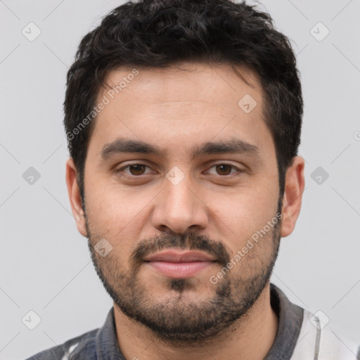 Joyful white young-adult male with short  black hair and brown eyes