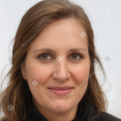 Joyful white adult female with long  brown hair and brown eyes