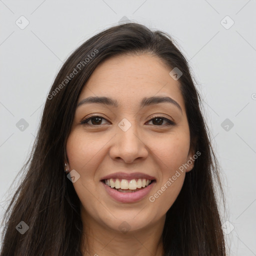 Joyful latino young-adult female with long  brown hair and brown eyes