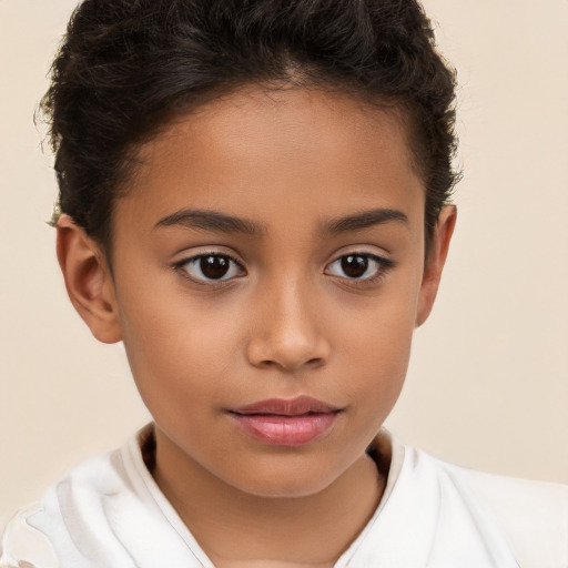 Joyful white child female with short  brown hair and brown eyes