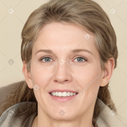 Joyful white young-adult female with medium  brown hair and grey eyes