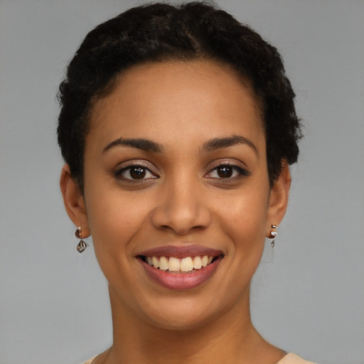 Joyful latino young-adult female with short  brown hair and brown eyes