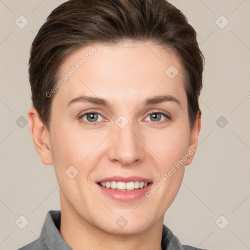 Joyful white young-adult female with short  brown hair and grey eyes