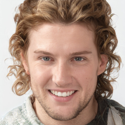 Joyful white young-adult male with medium  brown hair and blue eyes