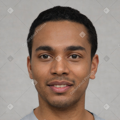 Joyful latino young-adult male with short  black hair and brown eyes