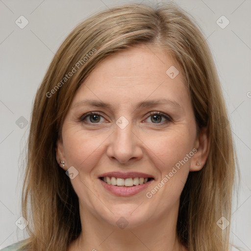 Joyful white adult female with medium  brown hair and grey eyes