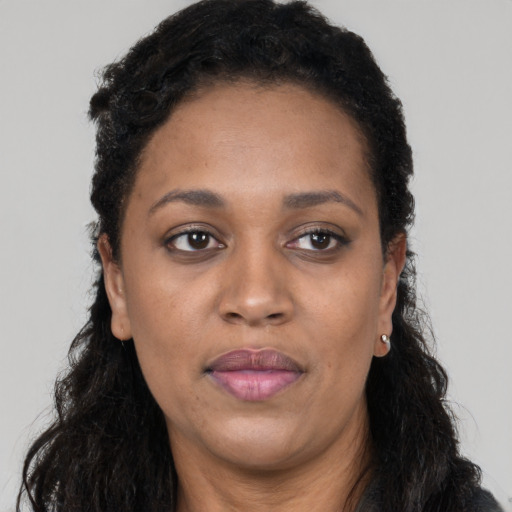 Neutral black adult female with long  black hair and brown eyes