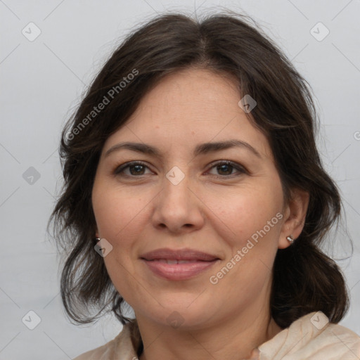 Joyful white adult female with medium  brown hair and brown eyes