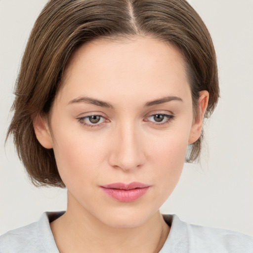 Neutral white young-adult female with medium  brown hair and grey eyes