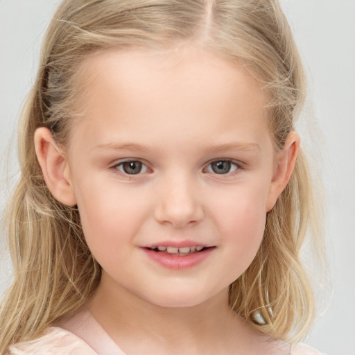 Joyful white child female with medium  brown hair and blue eyes