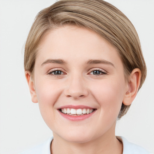 Joyful white young-adult female with medium  brown hair and blue eyes