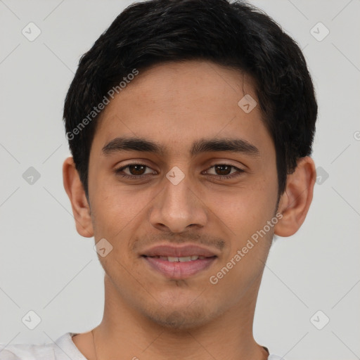 Joyful latino young-adult male with short  brown hair and brown eyes