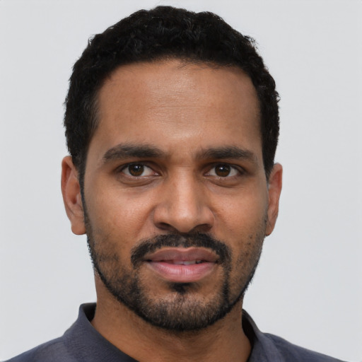 Neutral black young-adult male with short  black hair and brown eyes