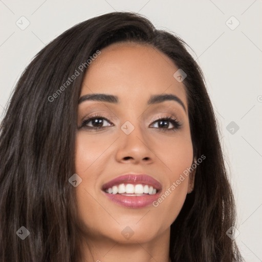 Joyful latino young-adult female with long  brown hair and brown eyes