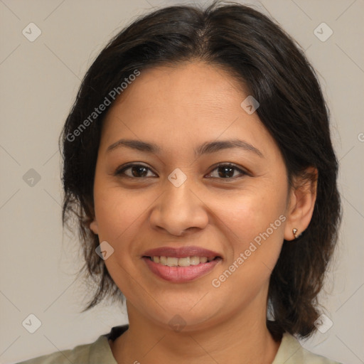 Joyful latino young-adult female with medium  brown hair and brown eyes