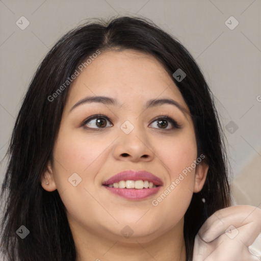 Joyful latino young-adult female with long  brown hair and brown eyes