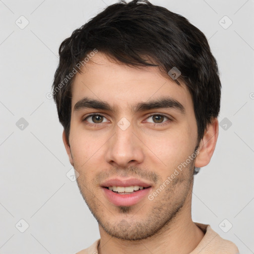 Joyful white young-adult male with short  black hair and brown eyes