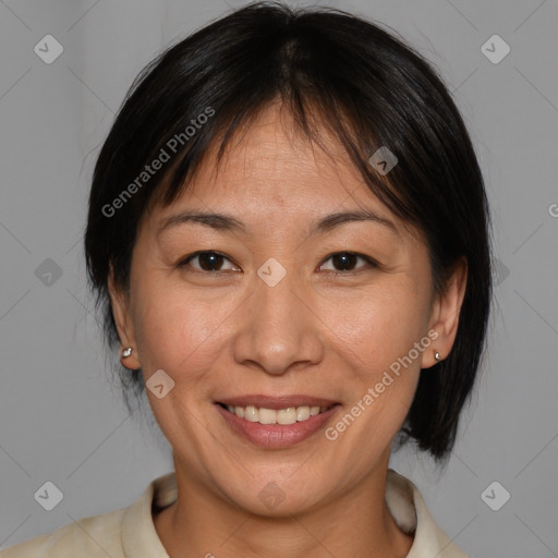 Joyful white adult female with medium  brown hair and brown eyes