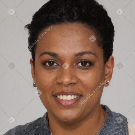 Joyful black young-adult female with short  black hair and brown eyes