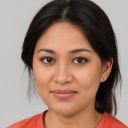 Joyful asian young-adult female with medium  brown hair and brown eyes