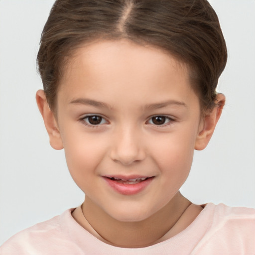 Joyful white child female with short  brown hair and brown eyes